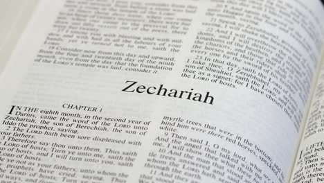 Close-Up-Shot-of-Bible-Page-Turning-to-the-book-of-Zechariah