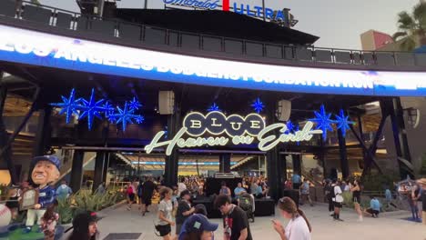 The-blue-Michelob-Heaven-on-Earth-Sign-at-Dodger-Stadium-with-people-gathering-for-a-game