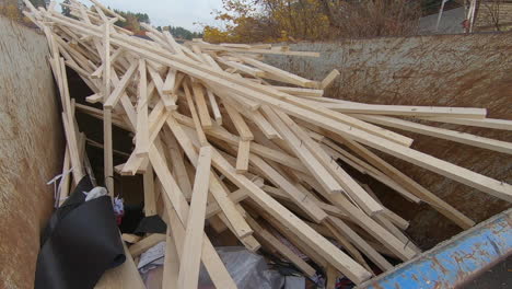 A-big-pile-of-wood-in-a-container-on-a-construction-site
