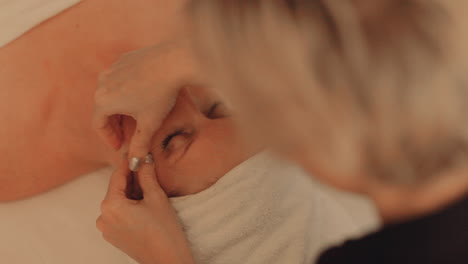 Beautiful-woman-getting-her-face-massaged