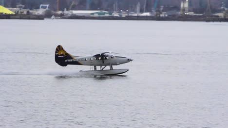 Small-passenger-plane-landing-on-a-beautiful-lake