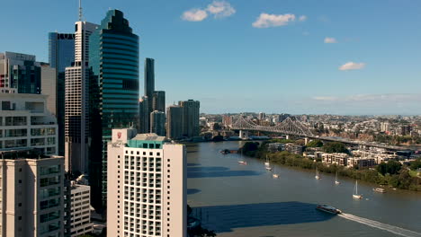 Aerial-of-Brisbane-story-bridge-and-city-and-ferry-on-Brisbane-river