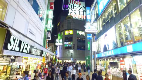 POV-walking,-Timelapse,-Thousands-of-people-walk-across-the-famous-Shibuya-Crossing-in-Tokyo-Japan