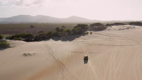 Aerial:-Buggy-driving-through-the-dunes-of-Cumbuco
