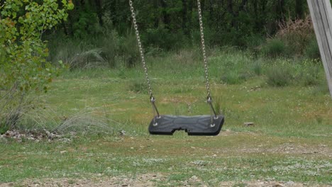 A-empty-swing-swinging-in-a-park