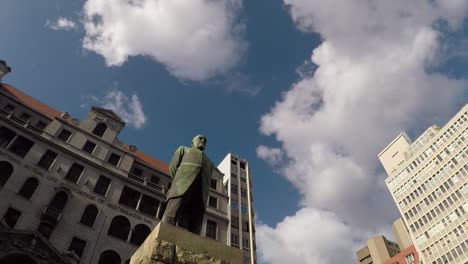 A-downward-tilt-revealing-the-statue-of-Jan-Hendrik-Hofmeyr-positioned-infront-of-the-Old-National-Mutual-building-on-Church-street