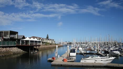 Sunny-day-at-the-marina-with-boats-docked-at-the-pontoons-and-clouds-in-the-sky
