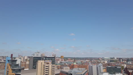 Fading-Out-Shot-of-Leeds-City-Centre-Skyline-during-Sunny-Summer’s-Day-from-High-Vantage-Point-with-Blue-Sky---Clouds