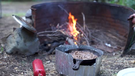 Campfire-cooking-meat-in-southern-Argentina,-close-up