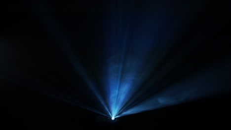 Projector-beam-cuts-through-fog-at-a-concert