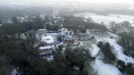Essex-large-mansion-in-25-acres-of-gardens-winter-aerial-4k