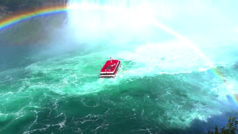 The-Maid-of-the-Mist-boat-sailing-under-a-rainbow-in-scenic-Niagara-Falls