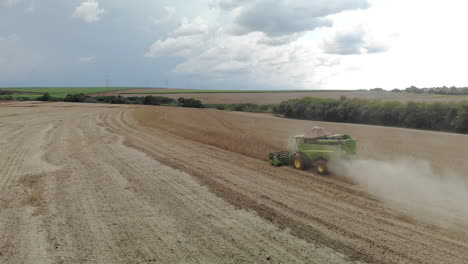 Agricultural-tractor-harvesting-soybeans-in-the-field