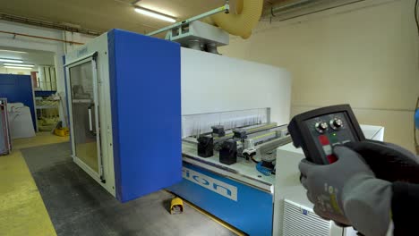 operating-CNC-machine-being-controlled-by-an-employee