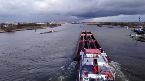Cola-Barge---Dry-Bulk-Cargo-Barge-Sailing-At-Oude-Maas-River-Loaded-With-6-Coal-Barges-Near-Puttershoek,-Netherlands
