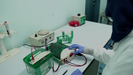 Female-Scientist-Using-Equipment-for-Electrolysis-Analysis