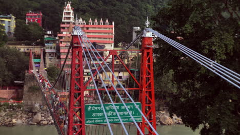 Ram-Jhula-as-called-is-a-bridge-on-River-Ganges-in-Rishikesh,-Uttarakhand,-India
