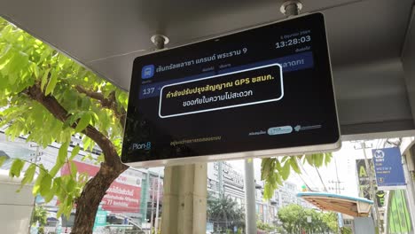 Bus-schedule-showing-system-error-on-a-bus-stop-in-midtown-of-modern-town-in-Bangkok,-Thailand