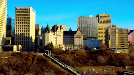 4k-Sunrise-aerial-panaramic-view-of-downtown-Edmontons-river-valley-high-rise-Telus-Tower-ATB-Financial-career-college-Edmonton-and-the-historic-Fairmont-Hotel-MacDonald-next-to-stairway-to-river-2-3