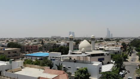 Aerial-Flying-Over-Rooftops-With-View-Of-Masjid-e-Ali-In-DHA-Phase-6-Karachi