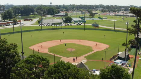 Aerial-of-Little-League-Youth-Travel-Baseball-team-playing-on-ball-field