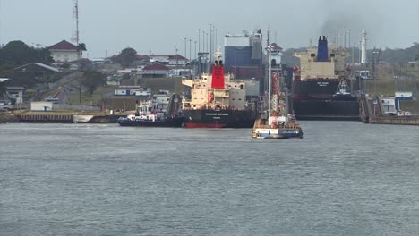 Ships-transiting-the-first-set-of-locks-at-Panama-Canal,-Gatun-locks