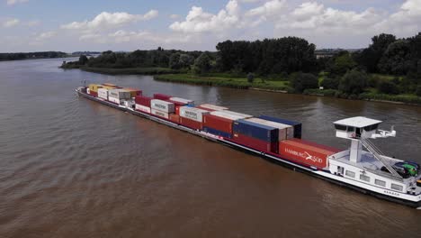 Aerial-Above-Port-Side-Of-Alsace-Cargo-Ship-Navigating-Oude-Maas