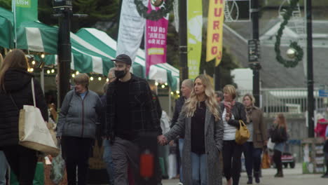 People-Walking-in-Slow-Motion-During-Covid-19-Pandemic-at-Farmers-Market-in-Truro,-Cornwall,-UK