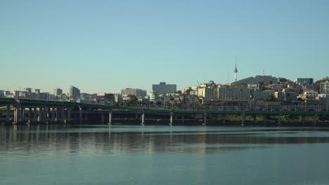 Seoul,-Yongsan-District,-N-Seoul-Tower,-Traffic-on-Gangbyeon-Expressway,-Hangang-River-Sunset,-Urban-Cloudless-Skyline