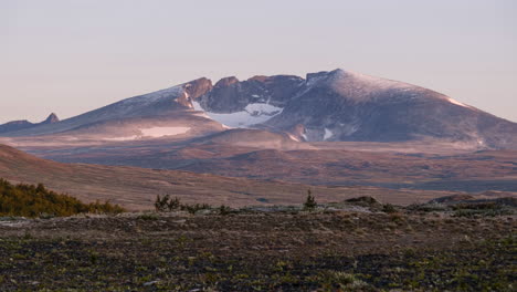 Sunrise-Timelapse-of-Snøhetta-mountain,-Dovrefjell-national-park,-Norway