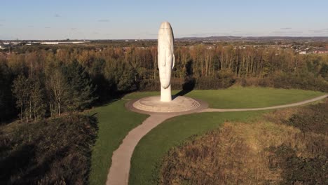 The-Dream-sculpture-Bold-forest-landmark-face-obelisk-statue-aerial-view-St-Helens-wide-reverse-left-orbit