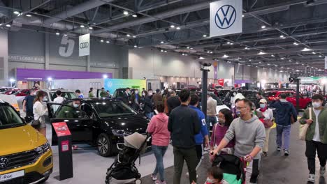 Families-and-visitors-are-seen-at-the-German-automobile-manufacturer,-Volkswagen-booth-for-sale-during-the-International-Motor-Expo-in-Hong-Kong