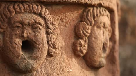 Faces-carved-in-the-red-sandstone-facade-of-the-Sao-Miguel-Das-Missoes-Jesuit-mission---sliding-close-up