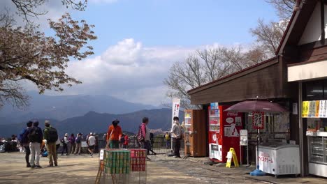 Beautiful-view-on-top-of-Mount-Takao-with-many-hikers-on-clear-blue-sky-day