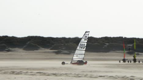 Blokart-at-high-speed-on-the-beach-of-Brouwersdam,-The-Netherlands