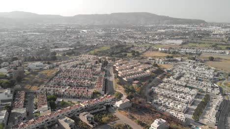 Aerial-view-of-residential-area-beside-hill-region-at-Alta-California,-Mexico