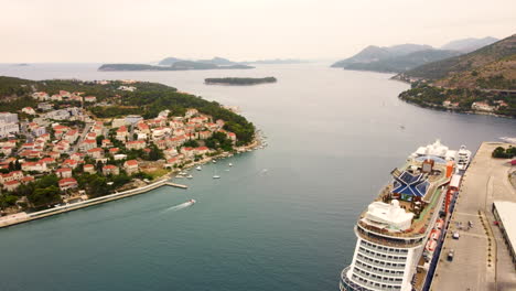Celebrity-Apex-Cruise-Ship-Docked-At-The-Port-With-Babin-Kuk-Neighborhood-In-The-Distance-In-Dubrovnik,-Croatia