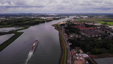 High-Aerial-View-Of-Viking-Ve-Cruise-Longship-Navigating-Along-River-Noord-Near-Hendrik-Ido-Ambacht