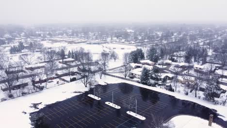 4K-drone-video-of-melted-parking-lot-in-suburbs-of-Grand-Rapids,-Michigan