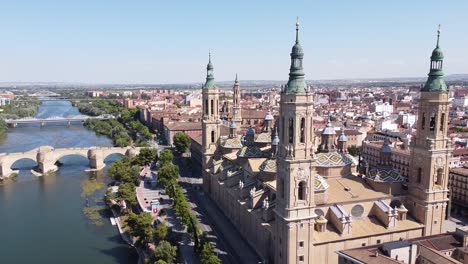 Zaragoza,-Aragon,-Spain---Aerial-Drone-View-of-Cathedral-Basilica-of-Our-Lady-of-the-Pillar,-Bridges-and-Ebro-River