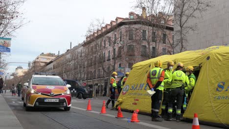 A-medical-emergency-car-unit-drives-by-as-teams-conduct-an-evacuation-exercise-drill-in-Madrid,-Spain