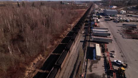 Cargo-train-passing-close-to-industrial-area,-Vancouver-in-Canada