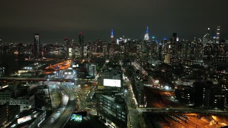 An-aerial-view-from-over-Long-Island-City,-New-York-at-night