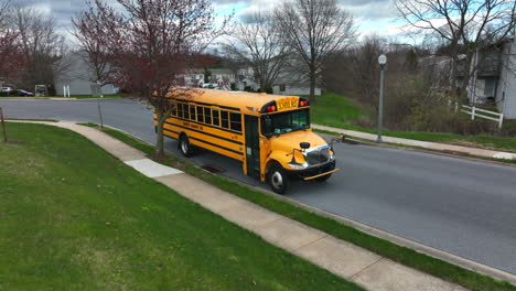 Yellow-school-bus-parked-along-street-in-USA