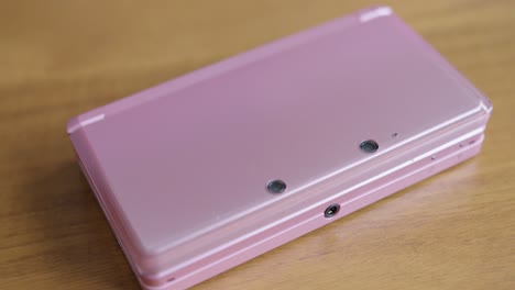 Close-Up-Pan-Right-of-a-Closed-Nintendo-3DS-Video-Game-System