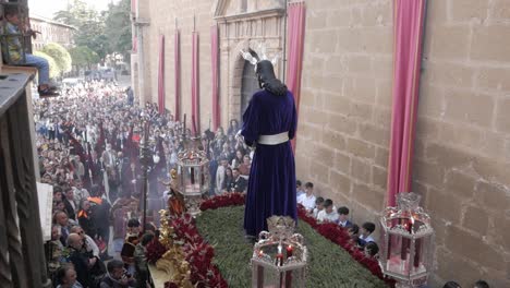 Image-Of-Jesus-Christ-On-Decorated-Paso-Carried-By-Porters-During-Easter-Procession-In-Crowded-Street