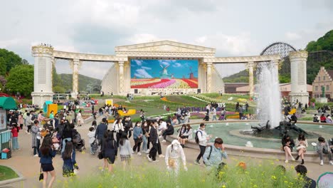 Families-enjoy-the-gardens-and-fountains-at-the-Everland-Amusement-Park-in-Yongin,-South-Korea