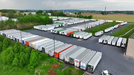 Aerial-drone-shot-of-tractor-trailer-trailers