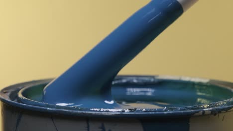 Close-up-of-PVC-pipe-stirring-and-pulling-out-of-blue-paint