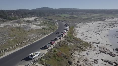California-State-Route-1-Road-and-Cars-Parked-Next-to-Beach,-Aerial-Establishing